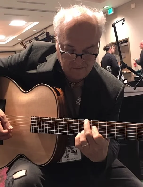 Paul Asbell playing guitar