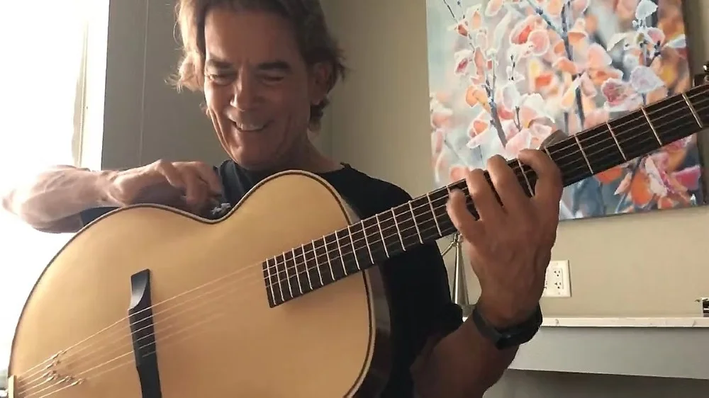 Michael Chapdelaine playing guitar
