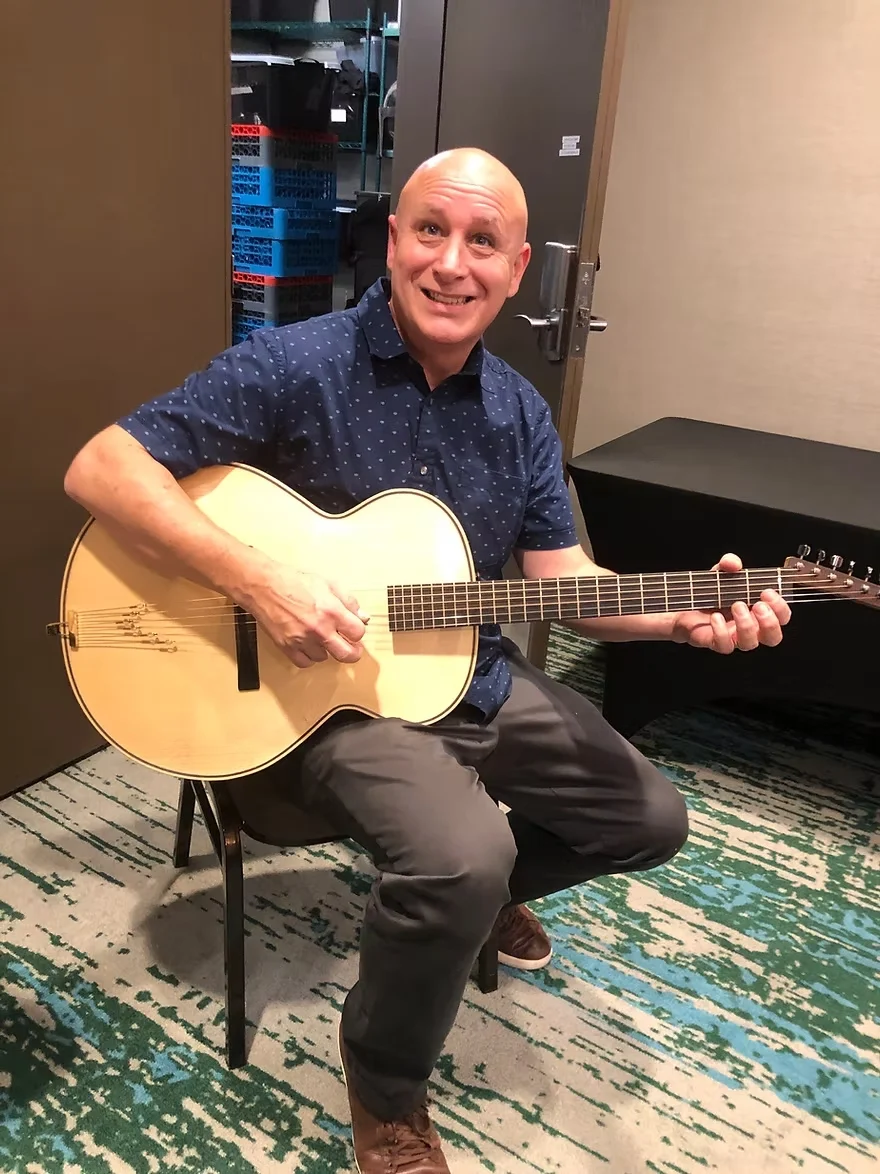 Ken Smith testing guitar