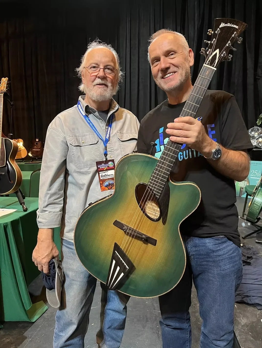 Visitors viewing Chinery Blue Guitars at showcase