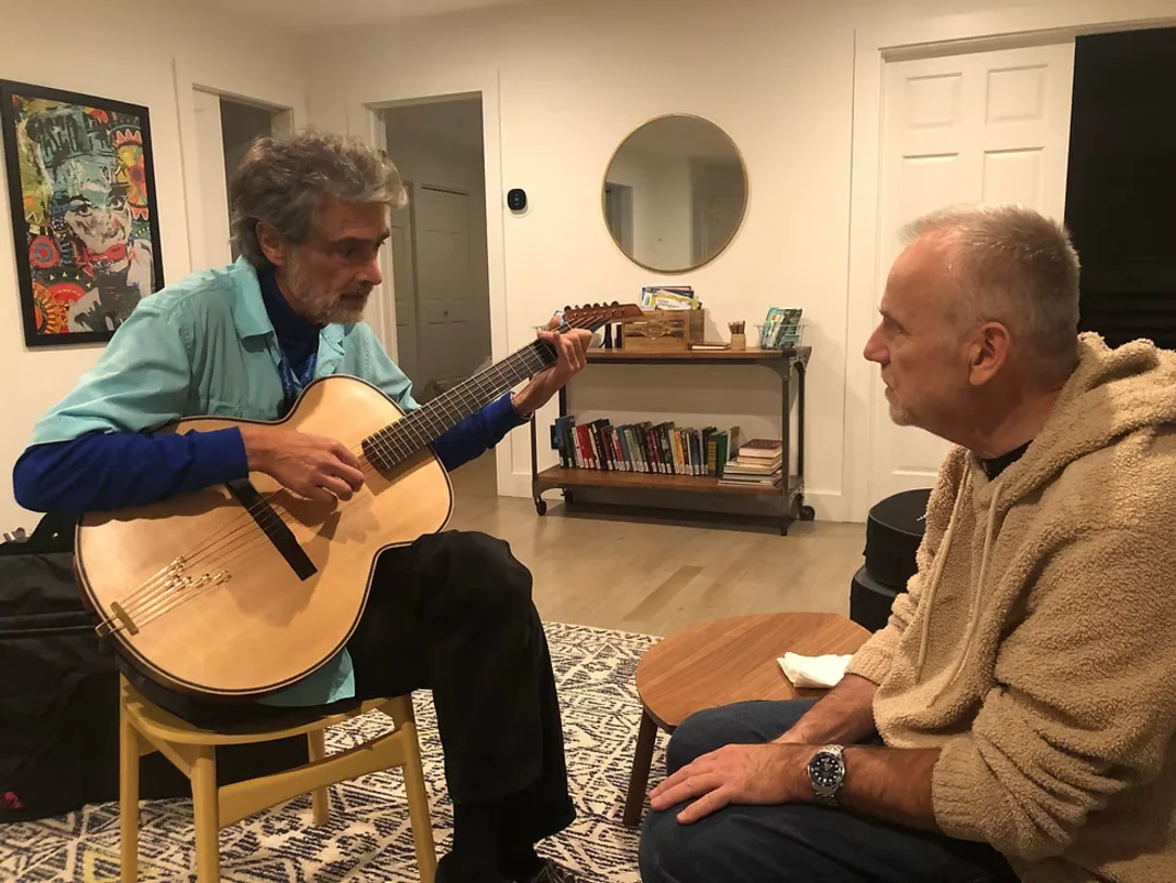 Kinloch Nelson playing Blue Arch guitar