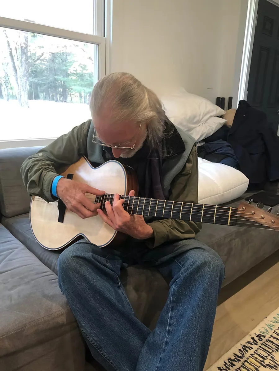Steve Klein evaluating guitar acoustically