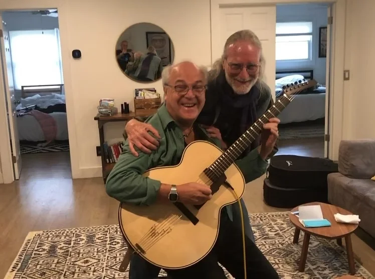 Side meeting with guitar luthier